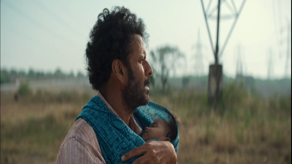 Watch as “Manoj Bajpayee appears solemn in the Joram trailer, trying to flee from Zeeshan Ayyub with his 3 months old daughter”.